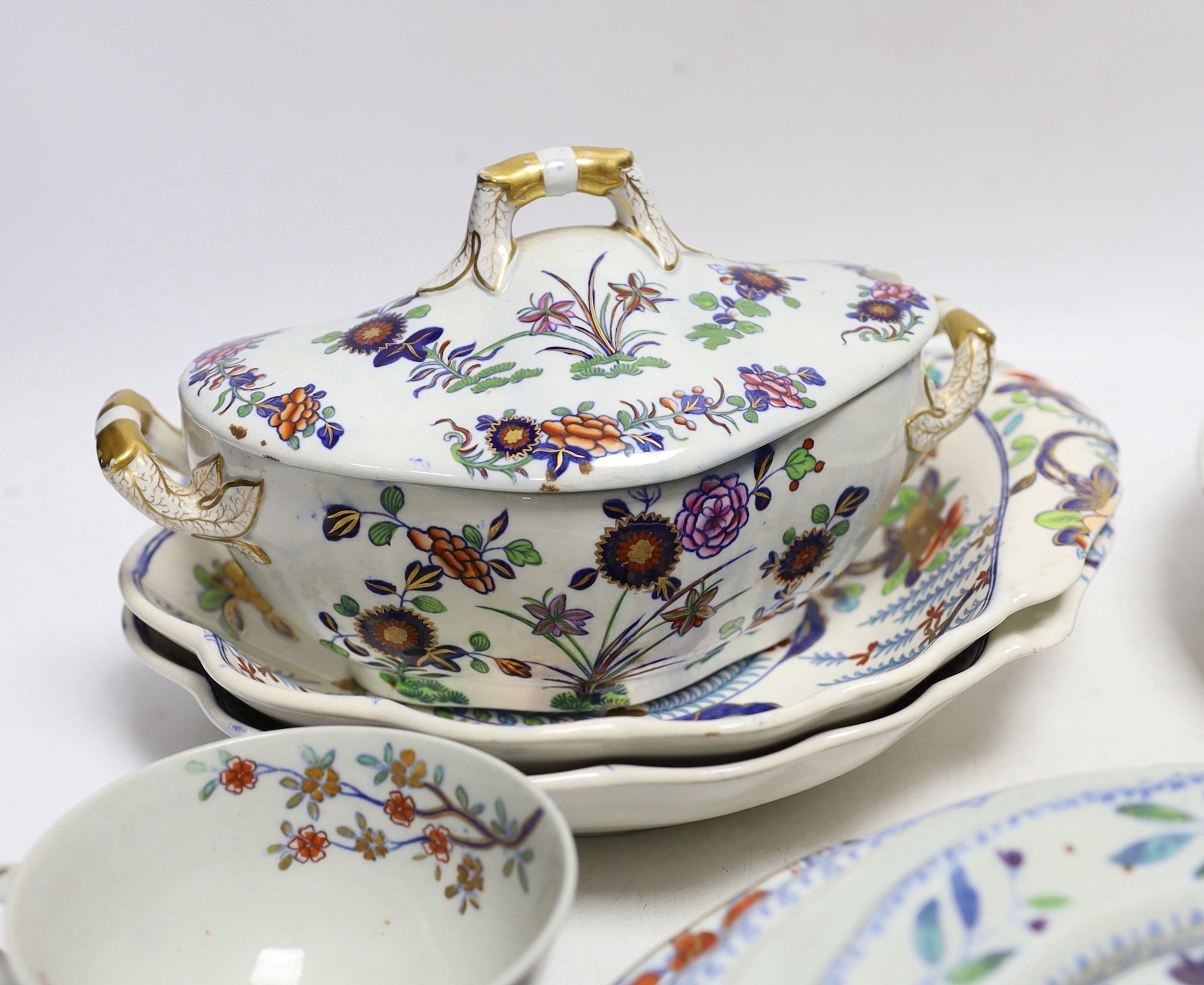 A collection of Spode Ironstone and pottery blue tea and dinnerware, including a pair of oval boat shaped sauce tureens and covers and a pair of shell shaped dessert dishes